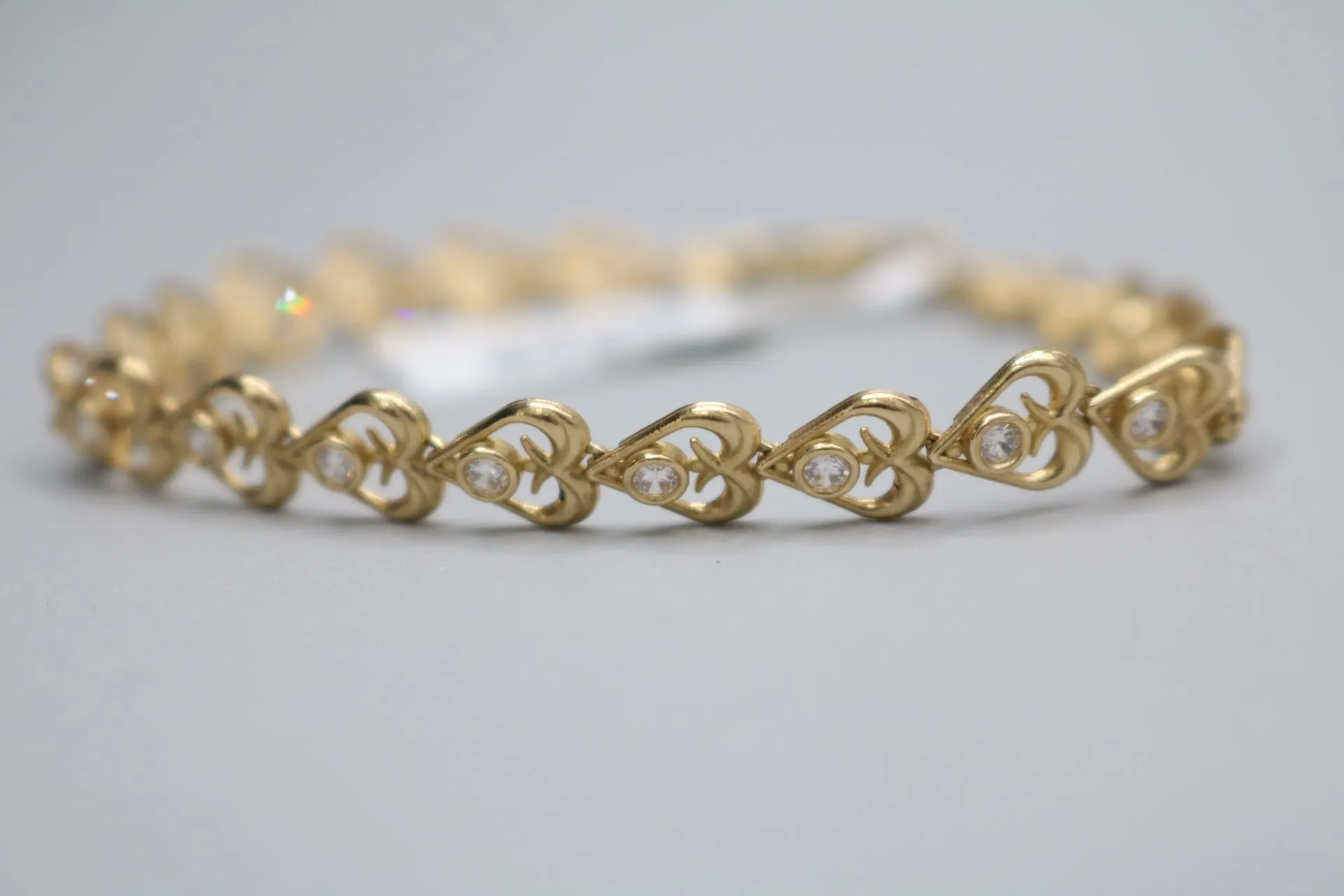 10k Yellow Gold Heart Fancy Lady's Bracelet w/clear stones (Length 7")