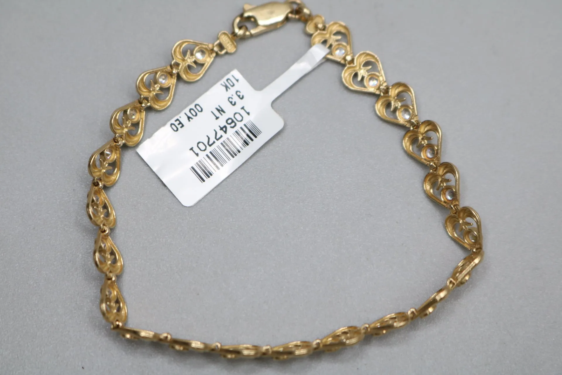 10k Yellow Gold Heart Fancy Lady's Bracelet w/clear stones (Length 7")