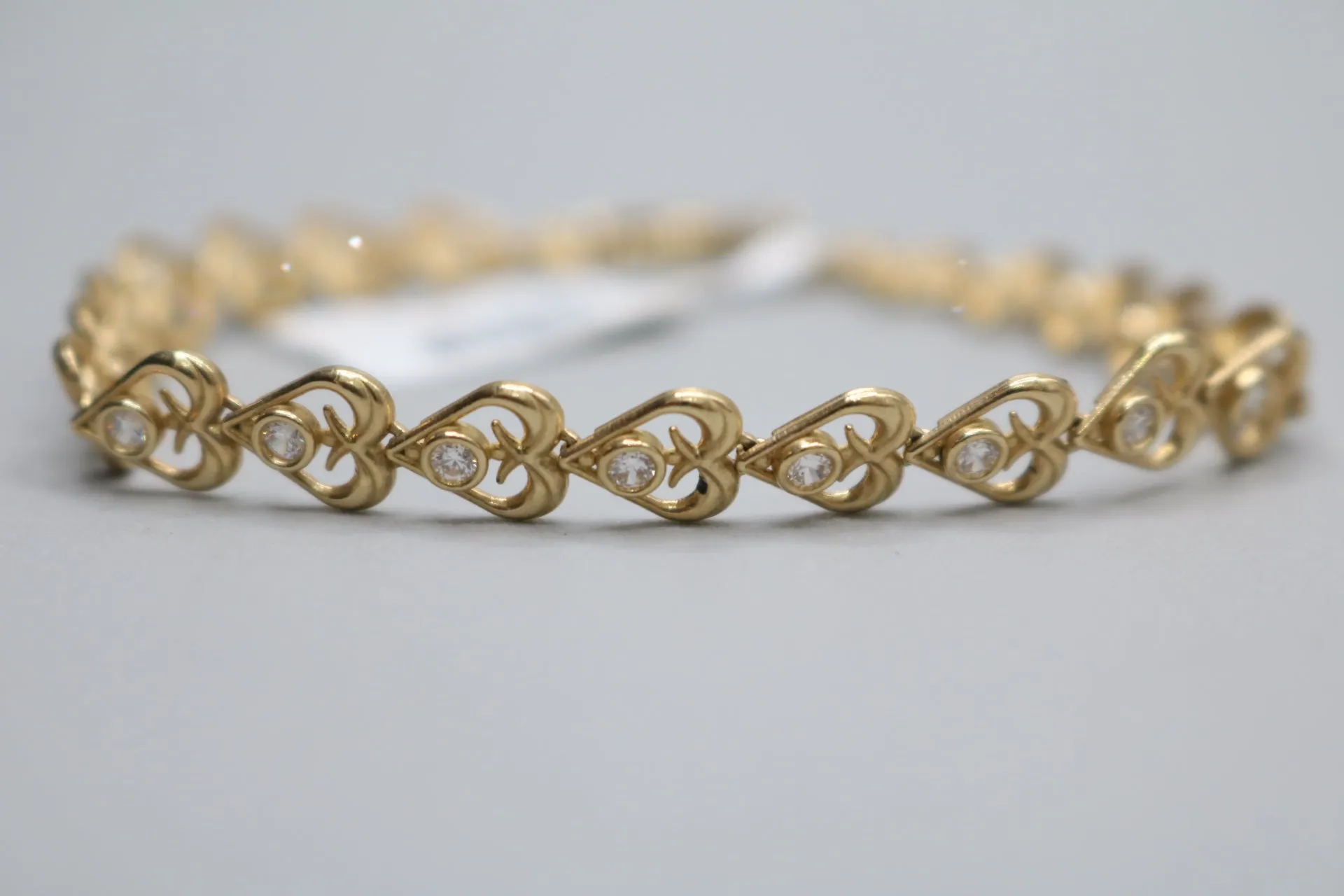 10k Yellow Gold Heart Fancy Lady's Bracelet w/clear stones (Length 7")