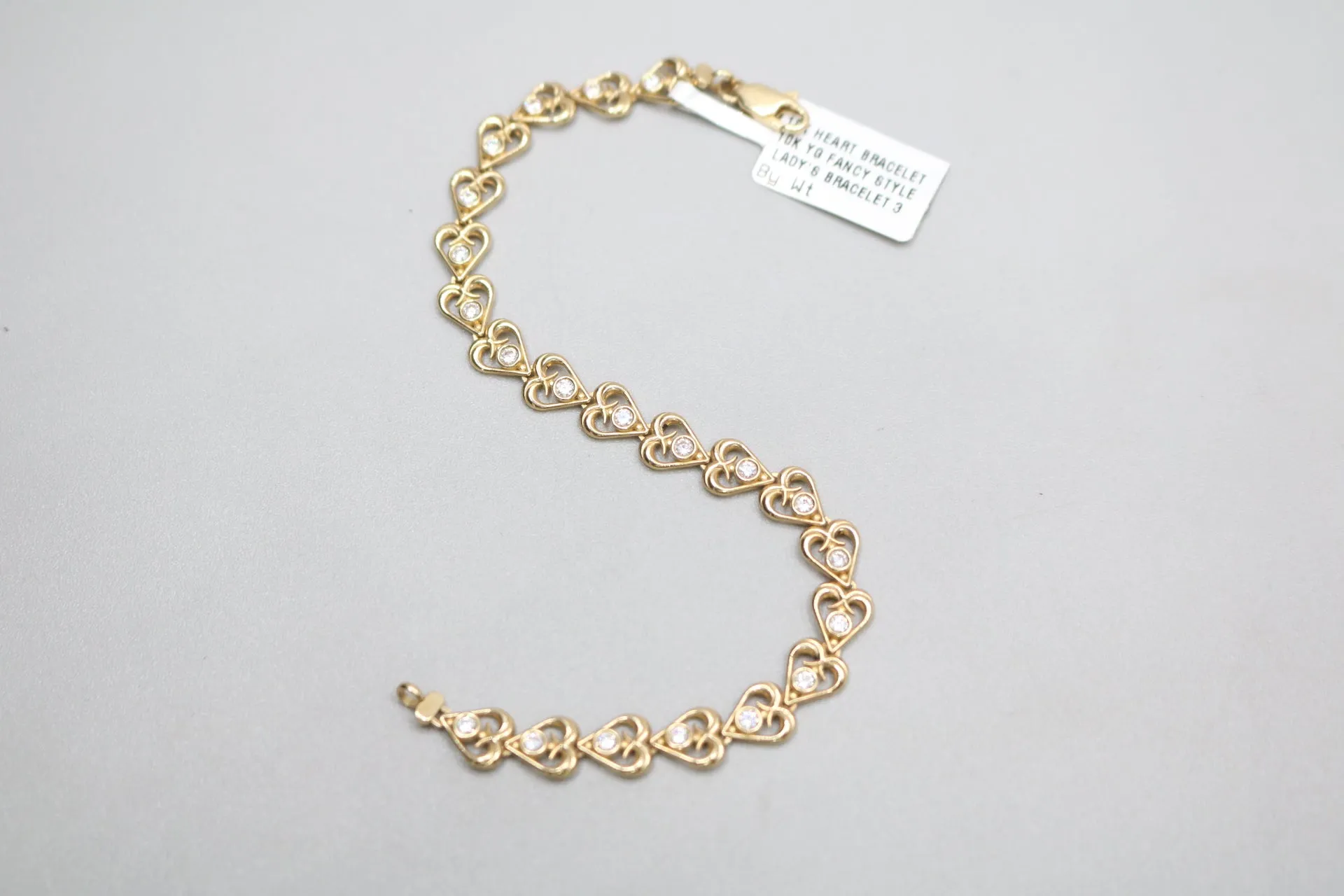 10k Yellow Gold Heart Fancy Lady's Bracelet w/clear stones (Length 7")