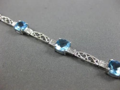 7.71CT DIAMOND & BLUE TOPAZ 14KT WHITE GOLD PAST PRESENT FUTURE TENNIS BRACELET