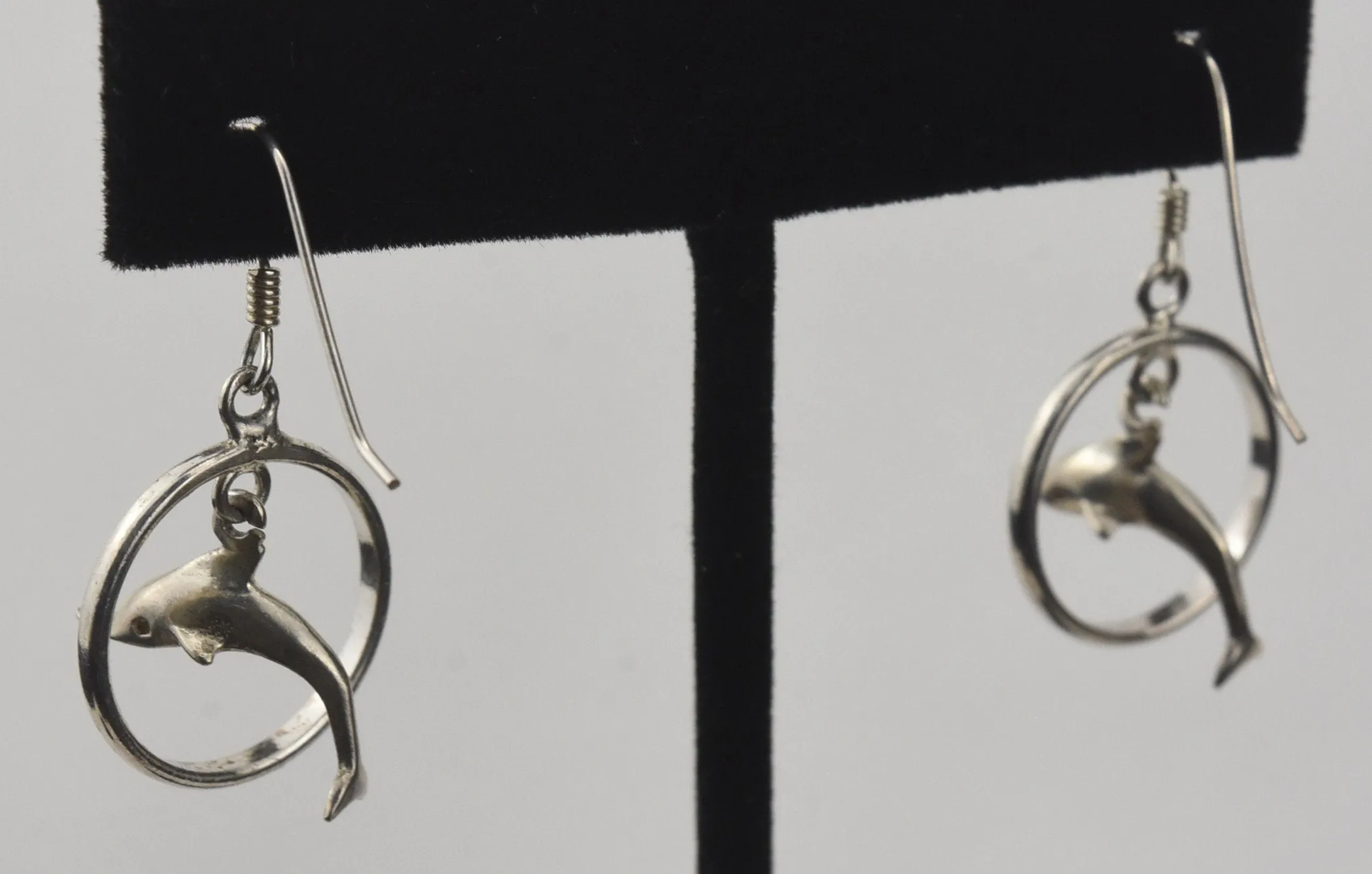 Sterling Silver Dangling Dolphins Hoop Earrings