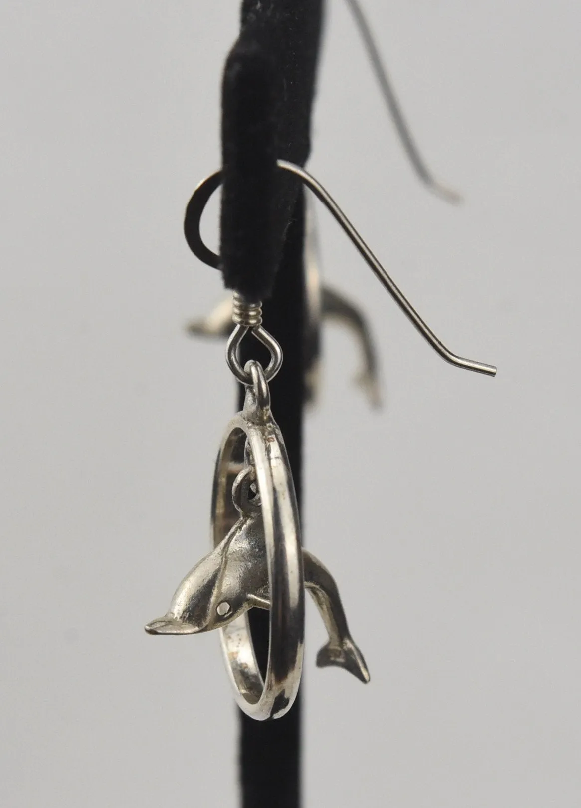 Sterling Silver Dangling Dolphins Hoop Earrings